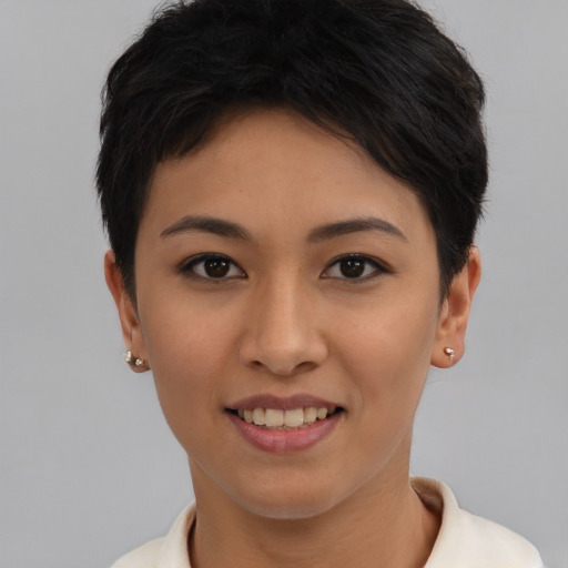 Joyful asian young-adult female with short  black hair and brown eyes