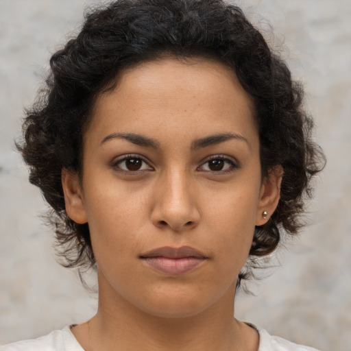 Neutral latino young-adult female with medium  brown hair and brown eyes