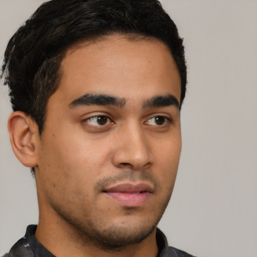 Neutral latino young-adult male with short  brown hair and brown eyes