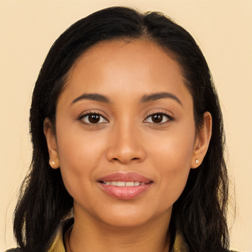 Joyful latino young-adult female with long  brown hair and brown eyes