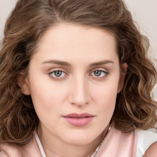 Joyful white young-adult female with medium  brown hair and green eyes