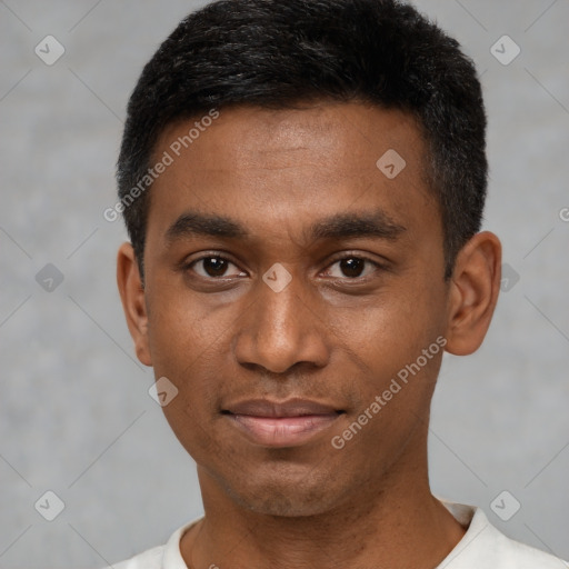 Joyful black young-adult male with short  black hair and brown eyes