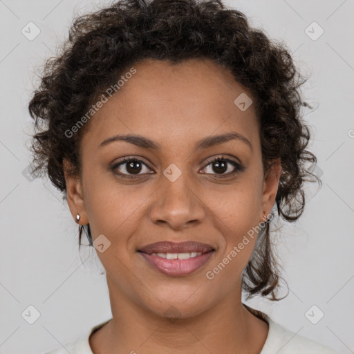 Joyful black young-adult female with short  brown hair and brown eyes