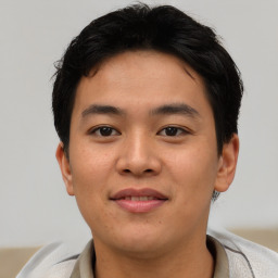 Joyful asian young-adult male with short  brown hair and brown eyes