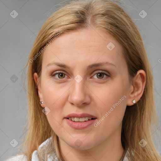 Joyful white adult female with long  brown hair and brown eyes