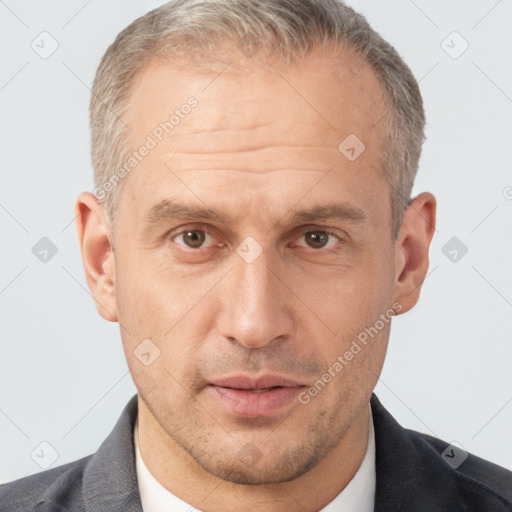 Neutral white middle-aged male with short  brown hair and brown eyes