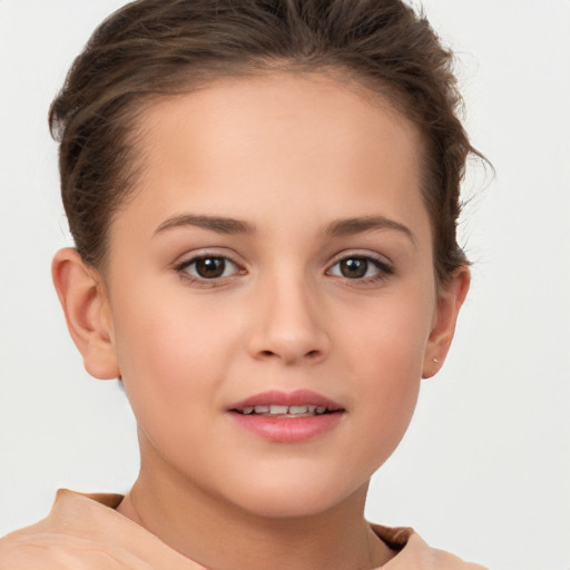 Joyful white child female with short  brown hair and brown eyes