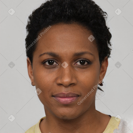 Joyful black young-adult female with short  black hair and brown eyes