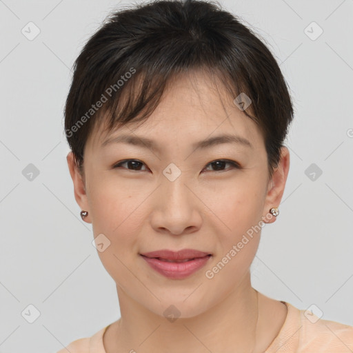 Joyful asian young-adult female with short  brown hair and brown eyes