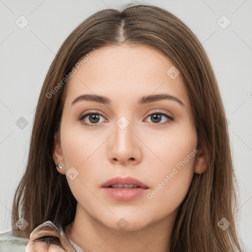 Neutral white young-adult female with long  brown hair and brown eyes