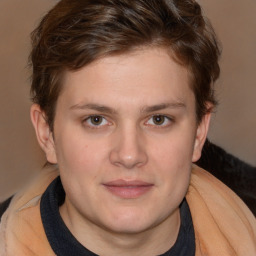 Joyful white young-adult male with medium  brown hair and brown eyes