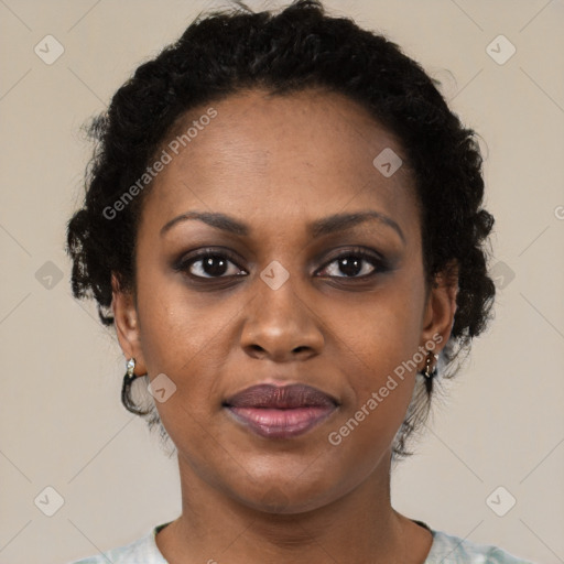 Joyful black adult female with short  brown hair and brown eyes