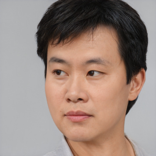 Neutral asian young-adult male with short  black hair and brown eyes