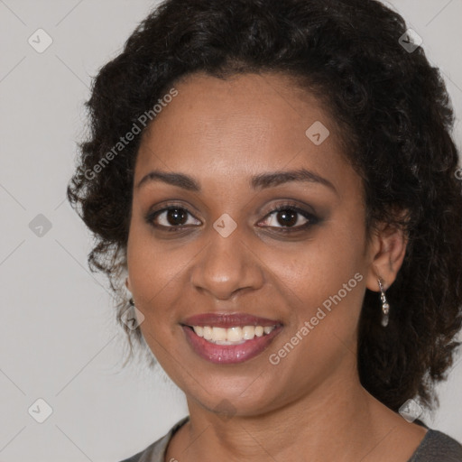 Joyful black young-adult female with medium  brown hair and brown eyes