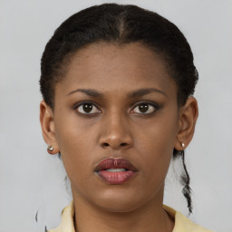 Neutral black young-adult female with short  brown hair and brown eyes