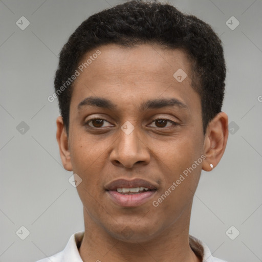 Joyful latino young-adult male with short  brown hair and brown eyes
