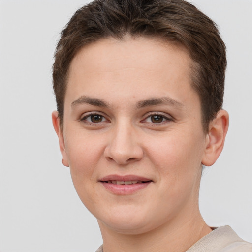 Joyful white young-adult female with short  brown hair and grey eyes