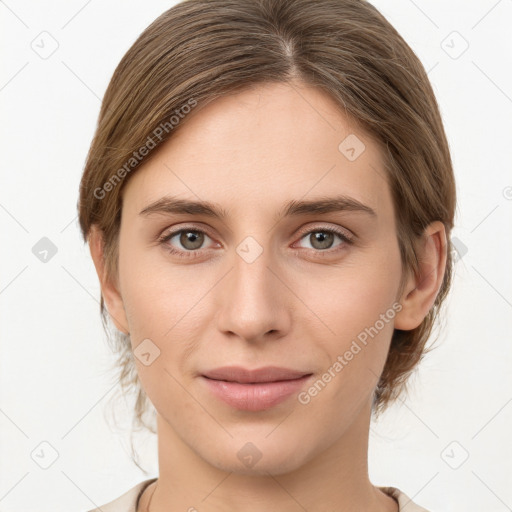 Joyful white young-adult female with medium  brown hair and grey eyes