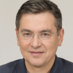 Joyful white middle-aged male with short  brown hair and brown eyes