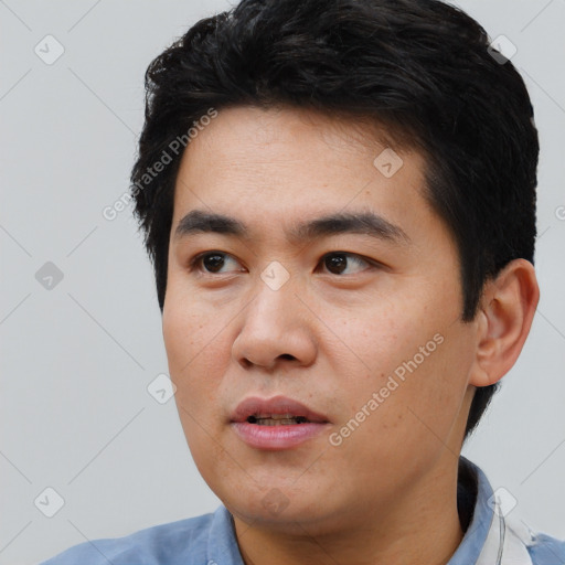 Neutral asian young-adult male with short  black hair and brown eyes