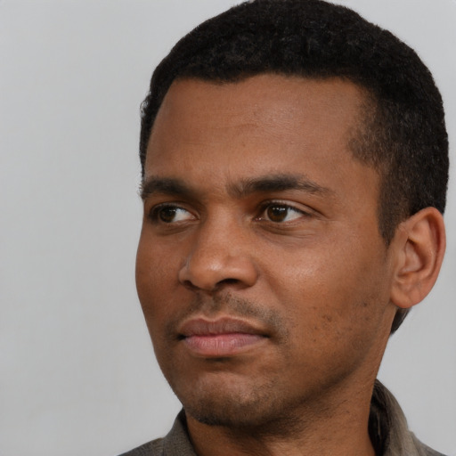 Neutral black young-adult male with short  black hair and brown eyes