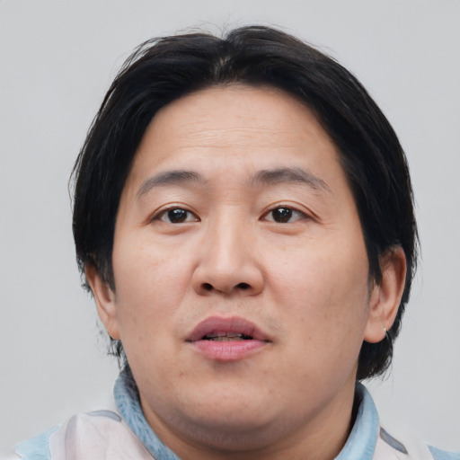 Neutral asian adult male with short  brown hair and brown eyes