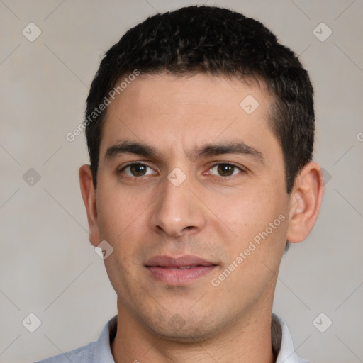 Joyful white young-adult male with short  black hair and brown eyes