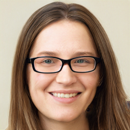 Joyful white young-adult female with long  brown hair and blue eyes