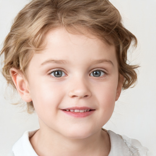 Joyful white child male with short  brown hair and grey eyes