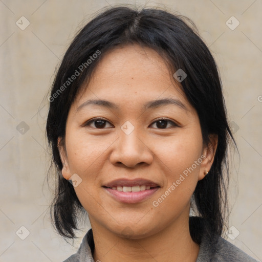 Joyful asian young-adult female with medium  black hair and brown eyes