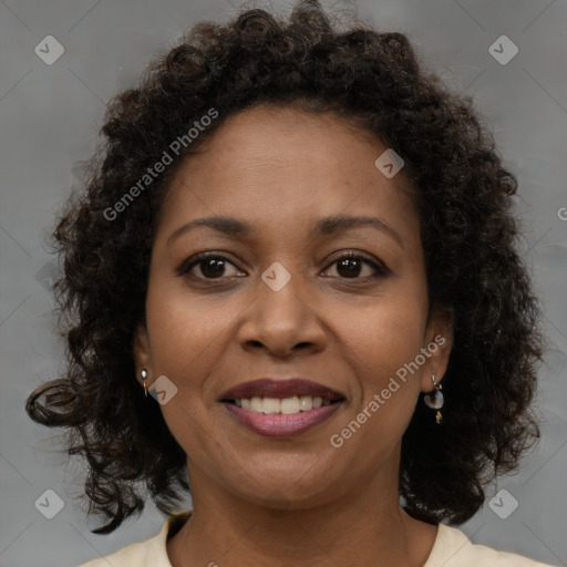 Joyful black young-adult female with medium  brown hair and brown eyes