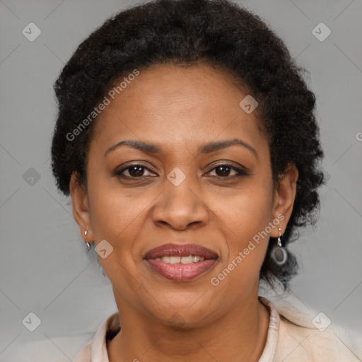 Joyful black adult female with short  brown hair and brown eyes