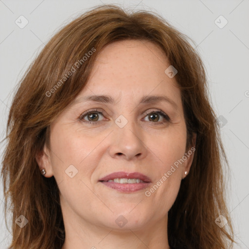 Joyful white adult female with long  brown hair and brown eyes