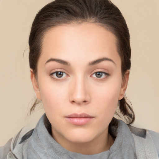 Neutral white young-adult female with medium  brown hair and brown eyes