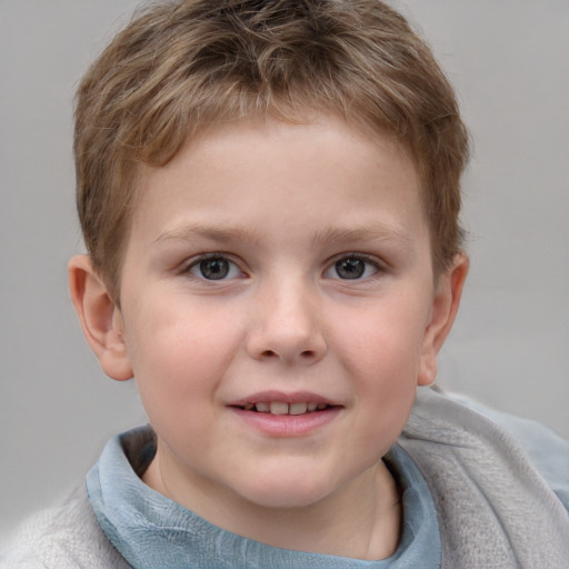 Joyful white child male with short  brown hair and grey eyes