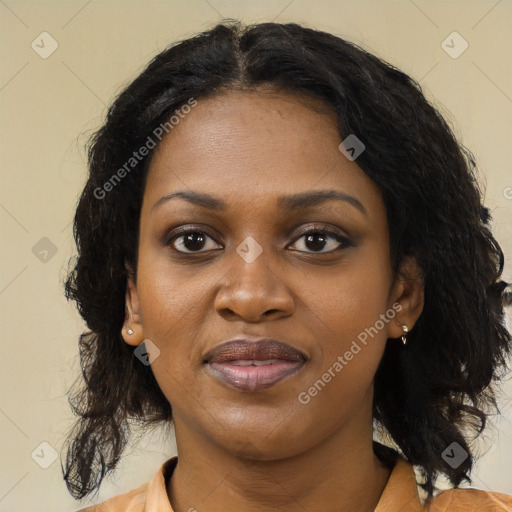 Joyful black young-adult female with long  brown hair and brown eyes