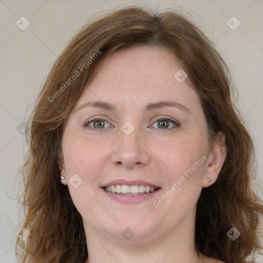 Joyful white adult female with medium  brown hair and grey eyes