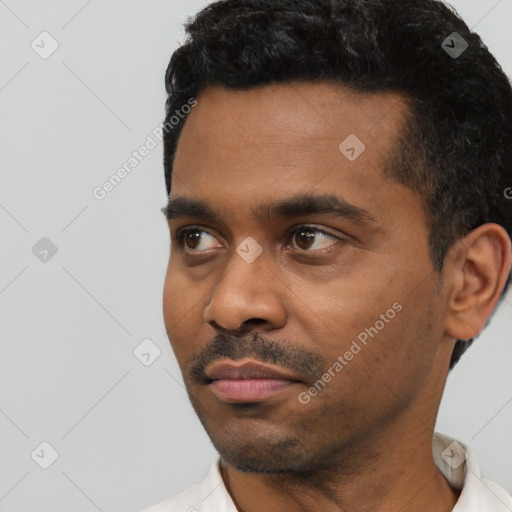 Neutral black young-adult male with short  black hair and brown eyes