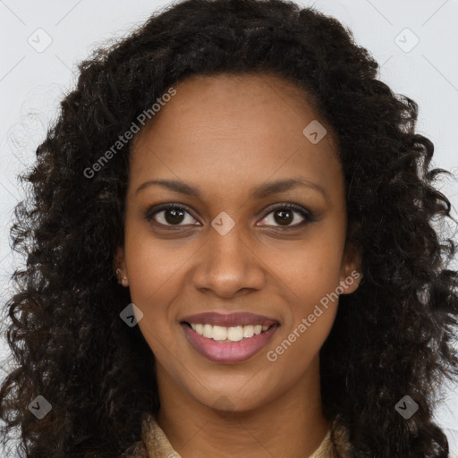 Joyful black young-adult female with long  brown hair and brown eyes