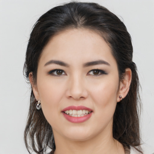 Joyful asian young-adult female with medium  brown hair and brown eyes
