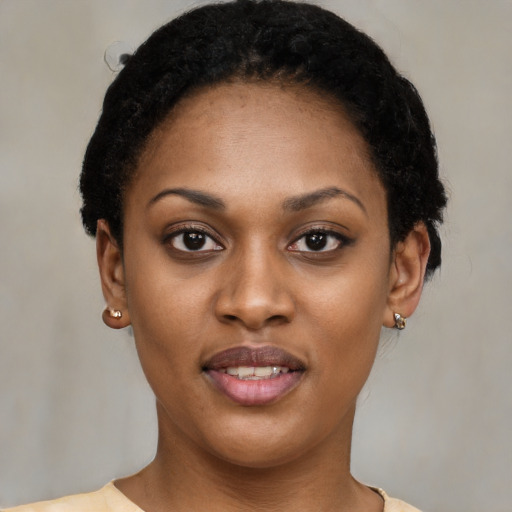 Joyful latino young-adult female with short  black hair and brown eyes