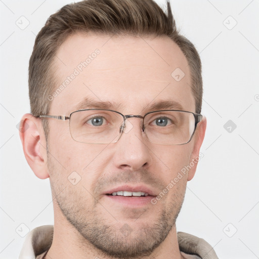 Joyful white adult male with short  brown hair and grey eyes