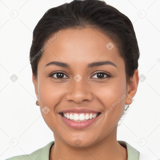 Joyful latino young-adult female with short  brown hair and brown eyes