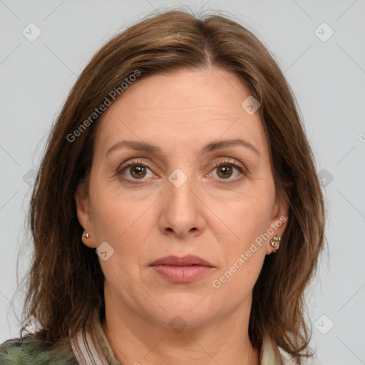 Joyful white adult female with medium  brown hair and grey eyes