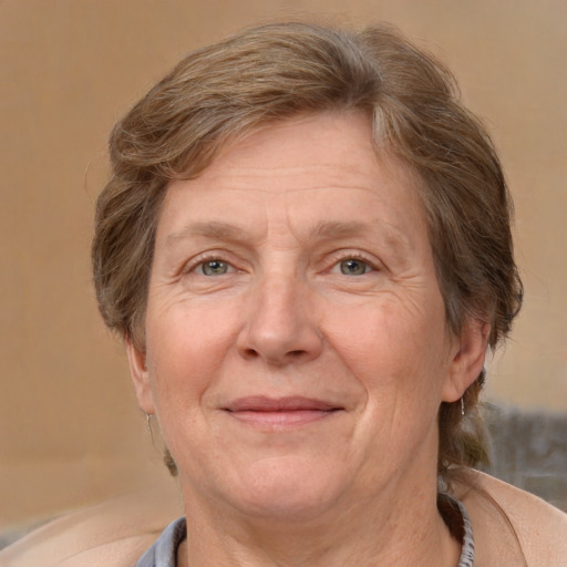 Joyful white middle-aged female with short  brown hair and brown eyes