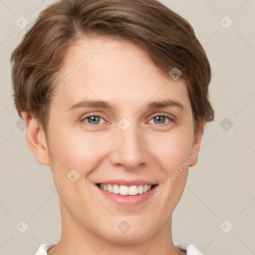 Joyful white young-adult female with short  brown hair and grey eyes