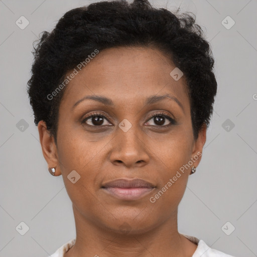 Joyful black adult female with short  brown hair and brown eyes