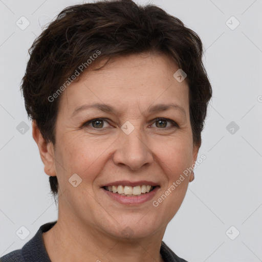 Joyful white adult female with short  brown hair and brown eyes