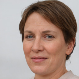 Joyful white adult female with short  brown hair and brown eyes