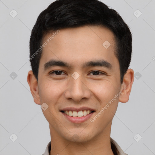 Joyful white young-adult male with short  black hair and brown eyes